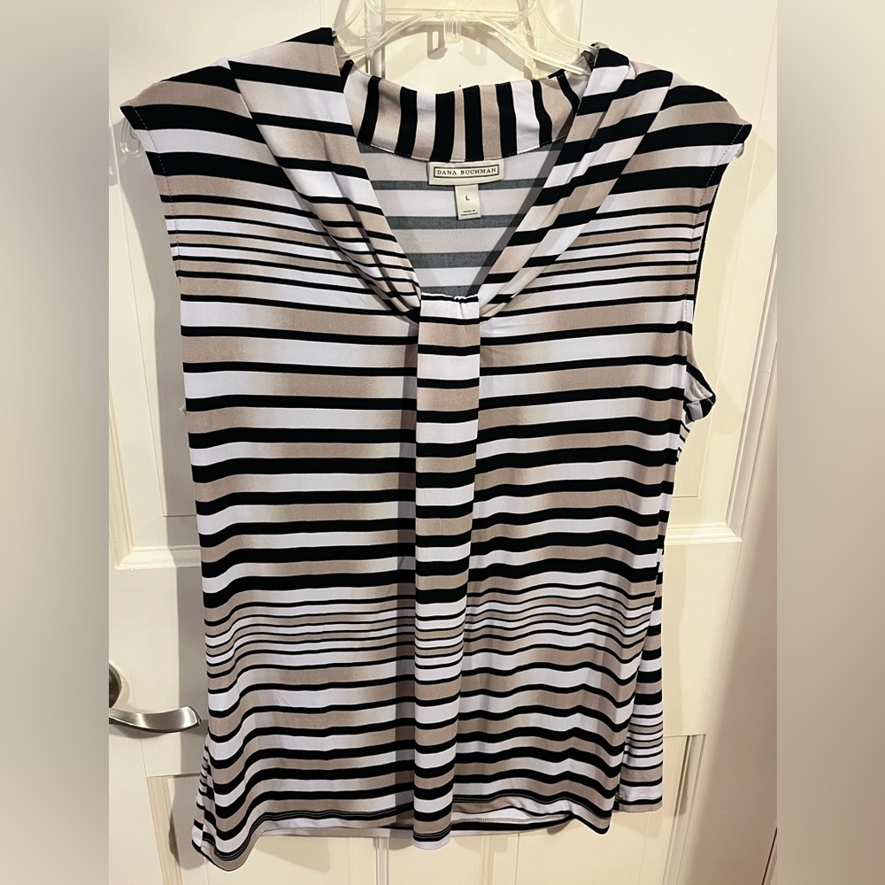 Sleeveless black tabs and white striped shirt.